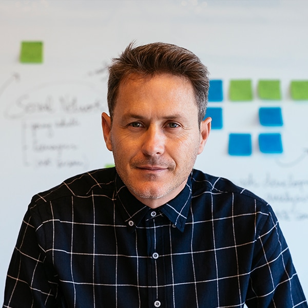 portrait of confident businessman in office in fro KUJMX5F